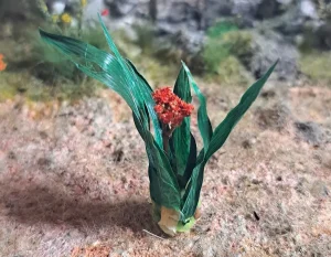 Pianta con fiore in miniatura realistica per diorama realizzata a mano con materiali naturali essiccati
